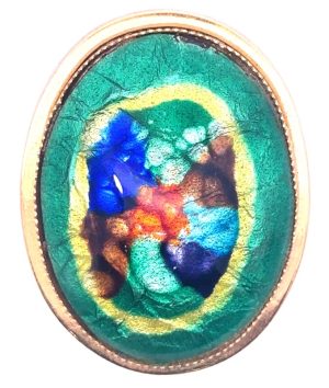 Vintage oval metallic brooch. Circa 1968-1974